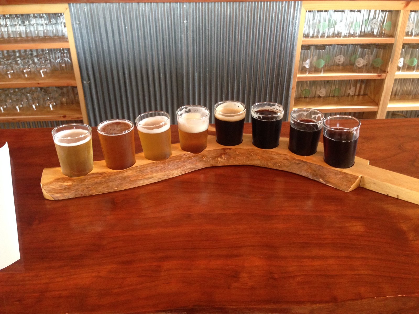 Wooden flight paddle of taster beers